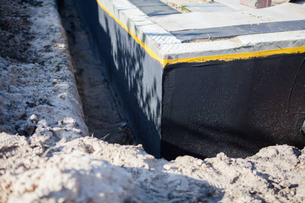 Professional Wet Basement Repair technician working in Norman, IN